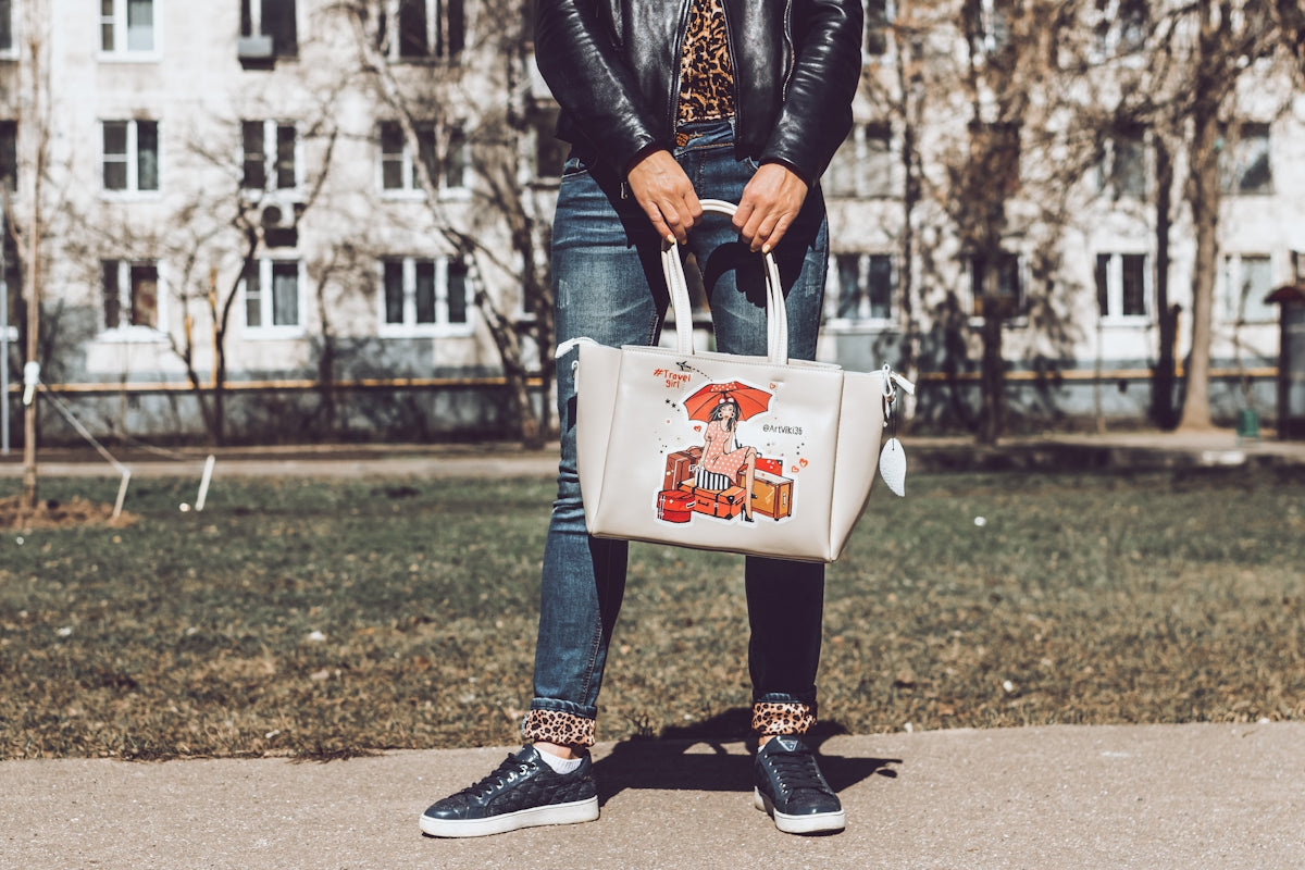 selective focus photography of woman carrying tote bag