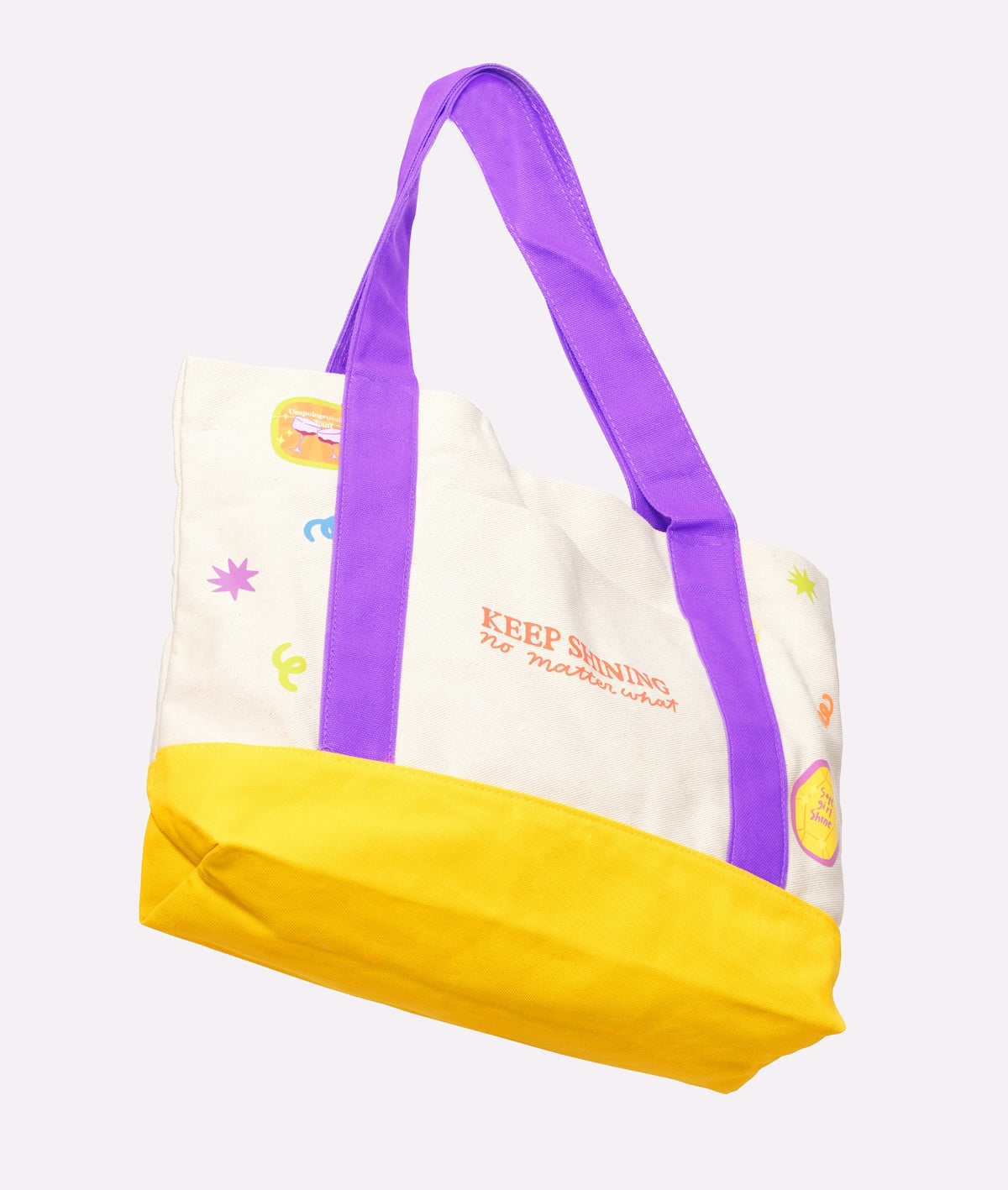 A white tote bag with yellow bottom and purple straps.